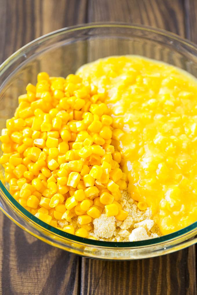 Corn Pudding Recipe | Corn Casserole | Corn Side Dish #corn #pudding #casserole #sidedish #thanksgiving #dinner #fuyos Corn kernels, creamed corn and cornbread mix in a bowl.