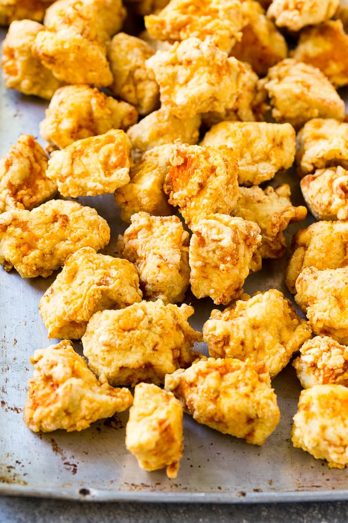 Sweet Chili Chicken Recipe | Thai Chicken | Asian Chicken #chicken #thaifood #chili #dinner #fuyos Fried chicken breast pieces on a sheet pan.