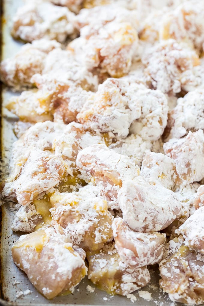 Sweet Chili Chicken Recipe | Thai Chicken | Asian Chicken #chicken #thaifood #chili #dinner #fuyos Chicken pieces coated in egg and flour.