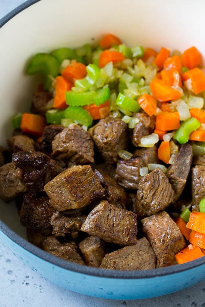 Beef Barley Soup Recipe | Beef Soup | Barley Soup #soup #beef #dinner #vegetables #fuyos #comfortfood Stew meat, carrots, onions and celery in a large pot.