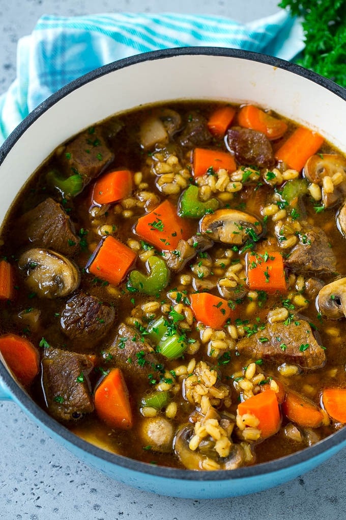 Beef Barley Soup Recipe | Beef Soup | Barley Soup #soup #beef #dinner #vegetables #fuyos #comfortfood A pot full of beef barley soup made with beef stew meat, barley and vegetables all simmered together.