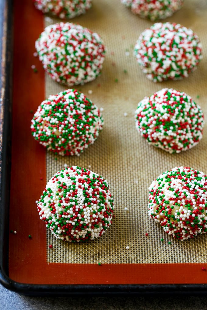 Gooey Butter Cookies Recipe | Cake Mix Cookies | Sprinkle Cookies | Christmas Cookies #cookies #butter #sprinkles #christmas #dessert #baking #fuyos Balls of dough rolled in sprinkles.