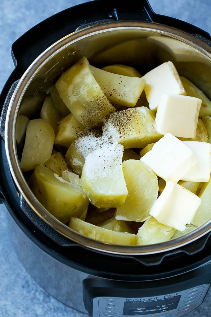 Instant Pot Mashed Potatoes Recipe | Pressure Cooker Mashed Potatoes | Easy Mashed Potatoes #potatoes #sidedish #instantpot #thanksgiving #dinner #fuyos Cooked chunks of potatoes with butter, milk and seasonings in an Instant Pot.