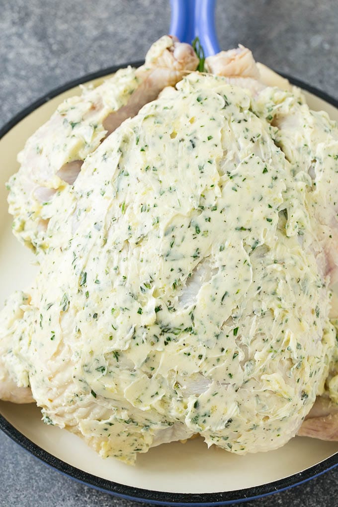 Roasted Chicken Recipe | Whole Roasted Chicken | Roast Chicken #chicken #dinner #lowcarb #keto #fuyos A raw whole chicken coated in garlic and herb butter.
