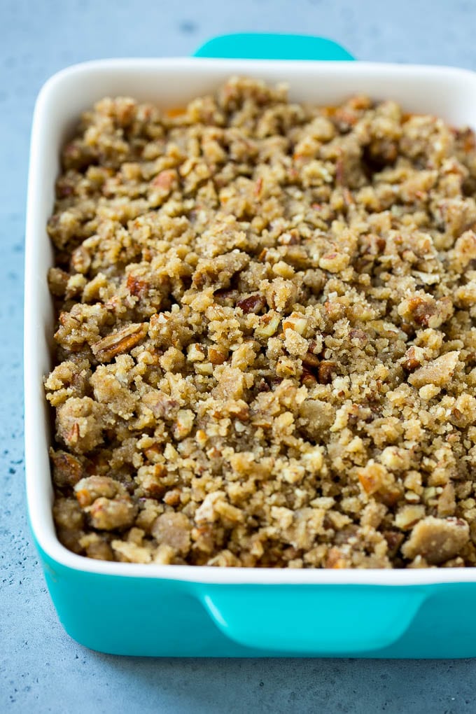 Ruth's Chris Sweet Potato Casserole Recipe | Sweet Potato Casserole | Mashed Sweet Potatoes #sweetpotatoes #casserole #thanksgiving #christmas #holidays #dinner #fuyos #sidedish Mashed sweet potatoes topped with a brown sugar and pecan streusel.