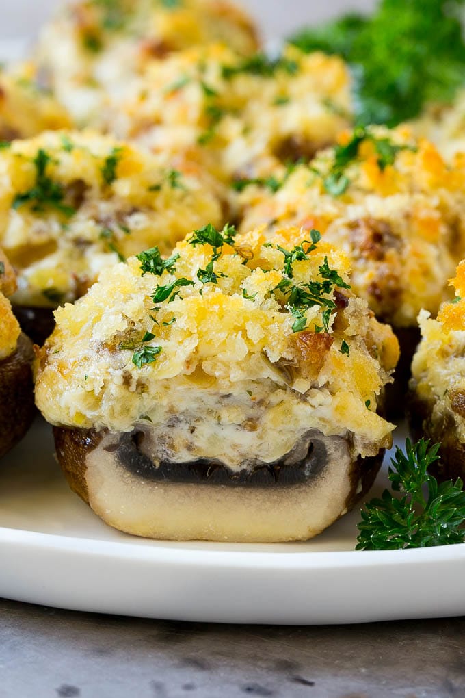 Sausage Stuffed Mushrooms Recipe | Stuffed Mushrooms | Mushroom Appetizer #mushrooms #sausage #appetizer #lowcarb #keto #fuyos A cross section of a sausage stuffed mushroom on a serving platter.