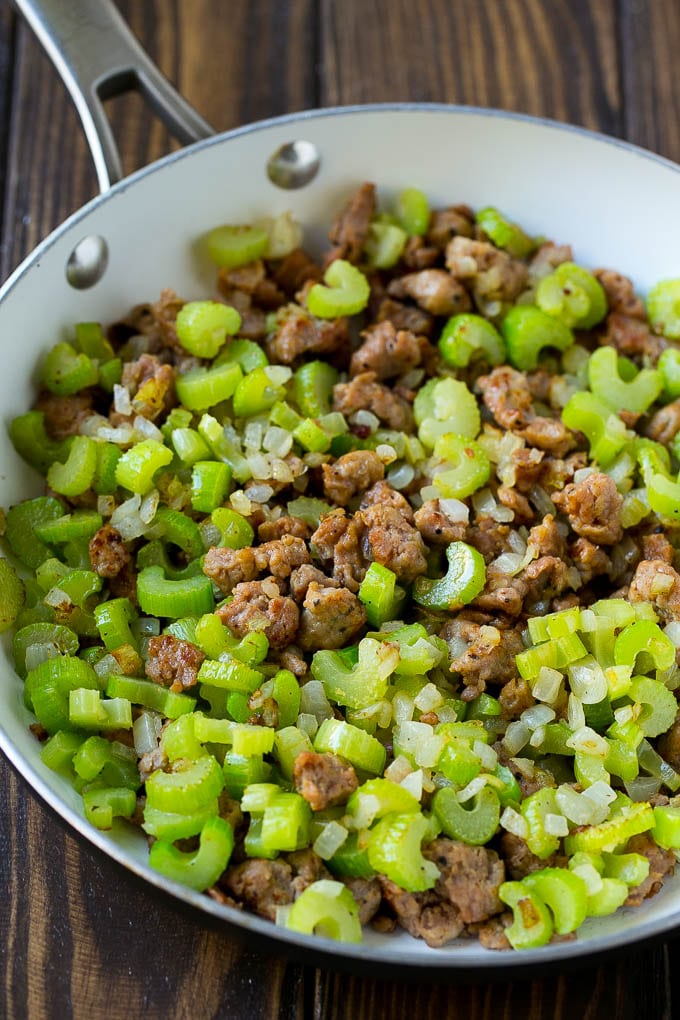 Sausage Stuffing Recipe | Thanksgiving Stuffing | Make Ahead Stuffing #stuffing #thanksgiving #sausage #sidedish #dinner #fuyos A pan of cooked sausage, celery and onions.
