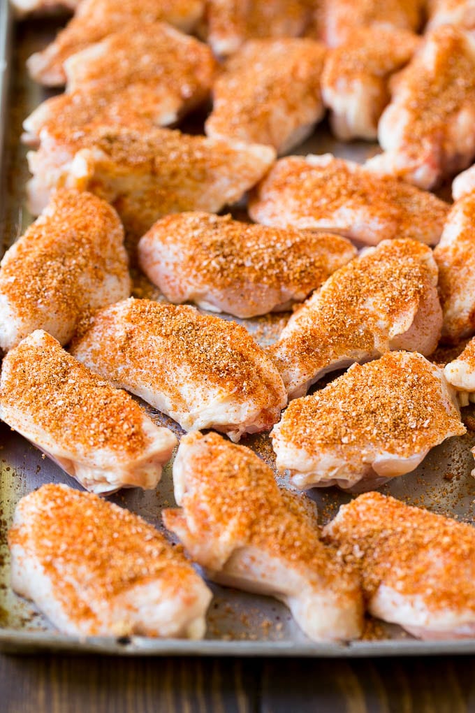 Smoked Chicken Wings | Barbecue Chicken Wings | BBQ Chicken Wings #chicken #wings #bbq #barbecue #appetizer #dinner #fuyos Raw chicken wings coated in homemade spice rub on a sheet pan.