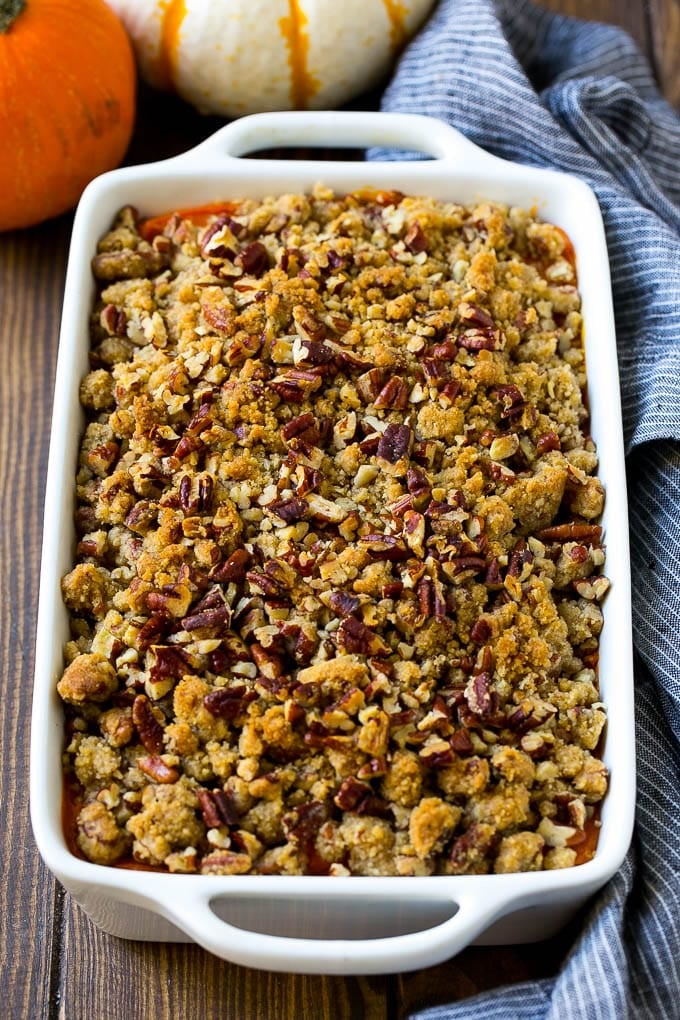 Sweet Potato Casserole with Pecans Recipe | Sweet Potato Casserole | Sweet Potato Side Dish #sweetpotatoes #thanksgiving #pecans #casserole #sidedish #holiday #fall #fuyos Sweet potato casserole with pecans and brown sugar streusel in a baking dish.