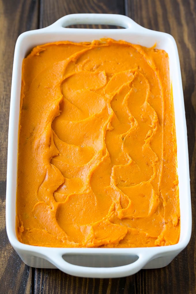 Sweet Potato Casserole with Pecans Recipe | Sweet Potato Casserole | Sweet Potato Side Dish #sweetpotatoes #thanksgiving #pecans #casserole #sidedish #holiday #fall #fuyos Mashed sweet potatoes in a baking dish.