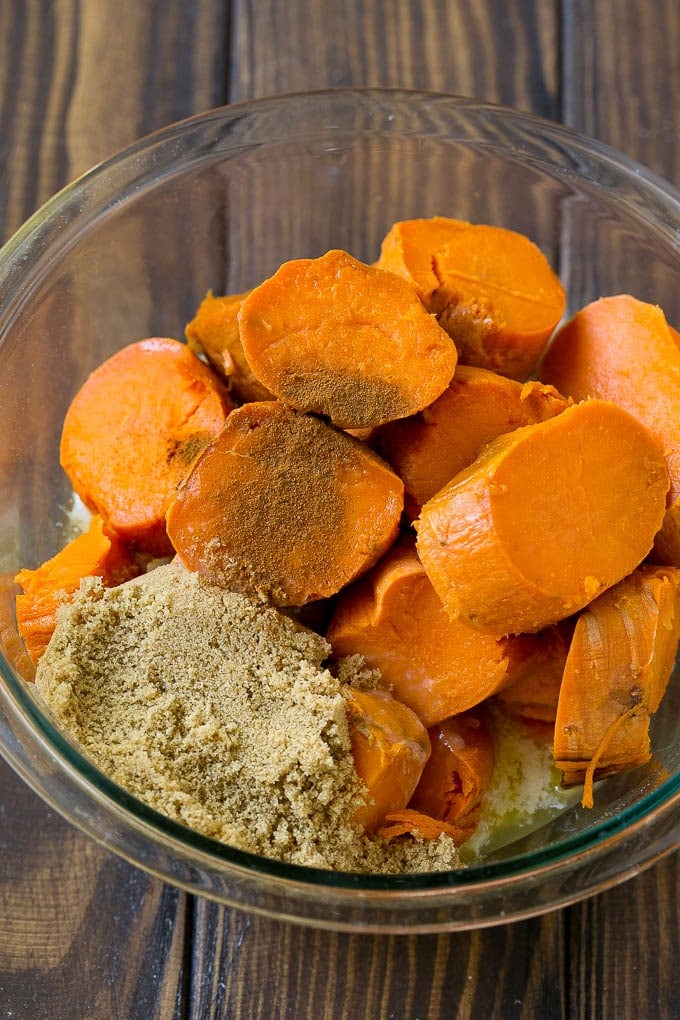 Sweet Potato Casserole with Pecans Recipe | Sweet Potato Casserole | Sweet Potato Side Dish #sweetpotatoes #thanksgiving #pecans #casserole #sidedish #holiday #fall #fuyos Sliced sweet potatoes with brown sugar, butter and spices.