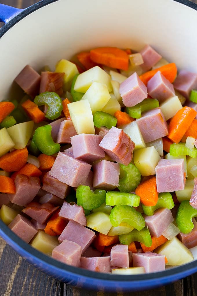 Ham and Potato Soup | Ham Soup | Potato Soup #soup #ham #potato #dinner #comfortfood #fuyos Diced ham, carrots, potatoes and celery in a soup pot.
