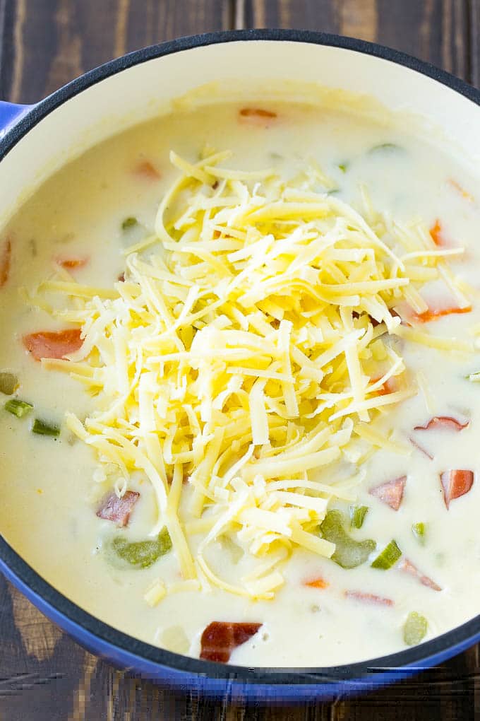 Ham and Potato Soup | Ham Soup | Potato Soup #soup #ham #potato #dinner #comfortfood #fuyos Shredded white cheddar cheese to be stirred into ham and potato soup.