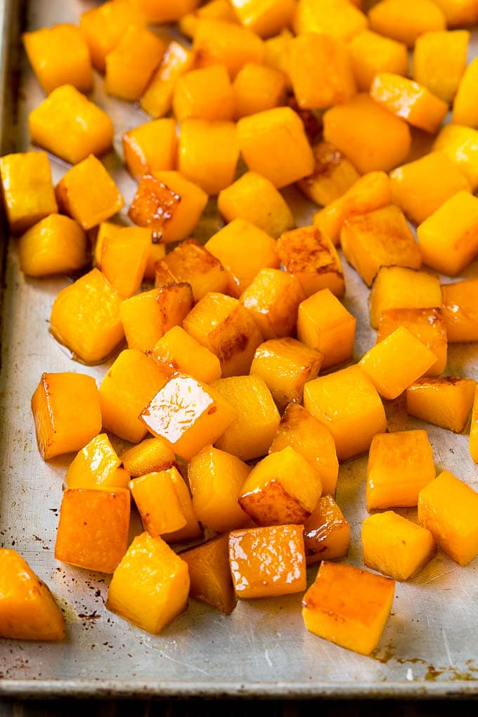 Roasted Butternut Squash Recipe | Baked Butternut Squash | Butternut Squash Side Dish #butternutsquash #squash #fall #vegetarian #dinner #fuyos Caramelized cooked butternut squash on a sheet pan.