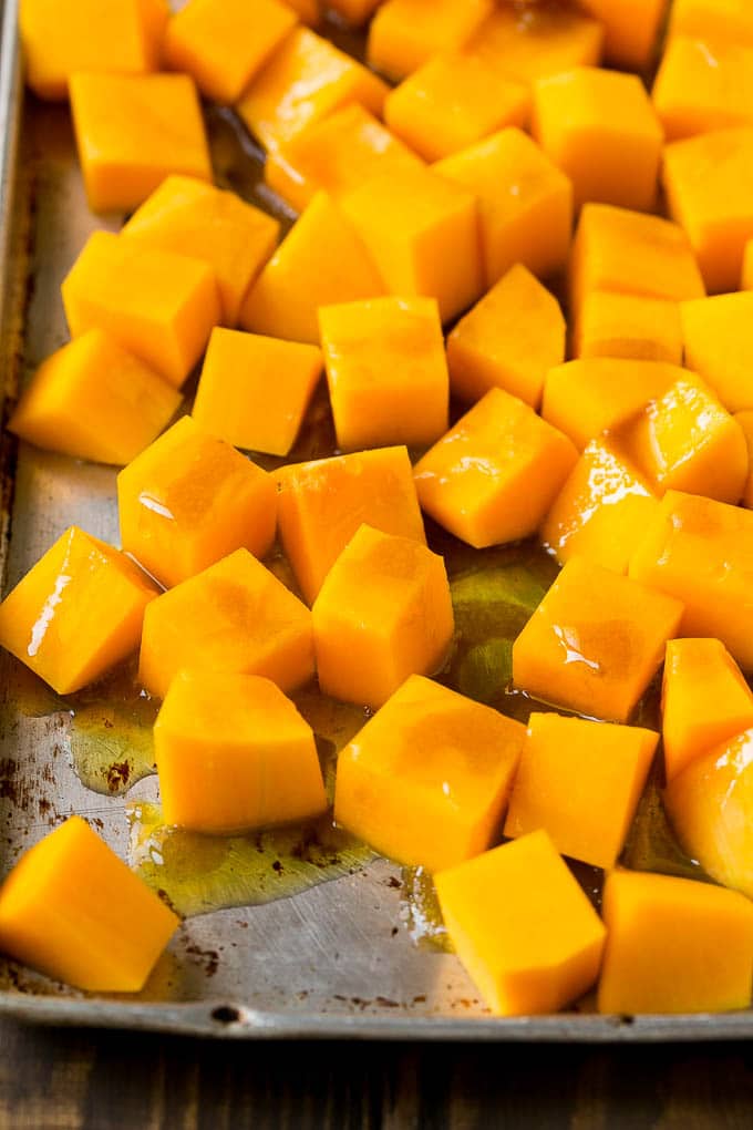 Roasted Butternut Squash Recipe | Baked Butternut Squash | Butternut Squash Side Dish #butternutsquash #squash #fall #vegetarian #dinner #fuyos Cubes of winter squash coated in olive oil, brown sugar and maple syrup.