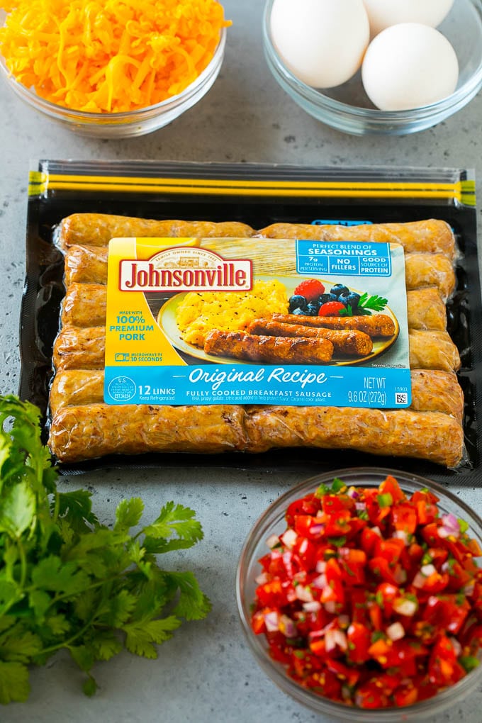 Breakfast Burrito Recipe | Sausage Breakfast Burrito #breakfast #sausage #eggs #burrito #fuyos A package of sausage links along with bowls of pico de gallo, eggs and shredded cheese.