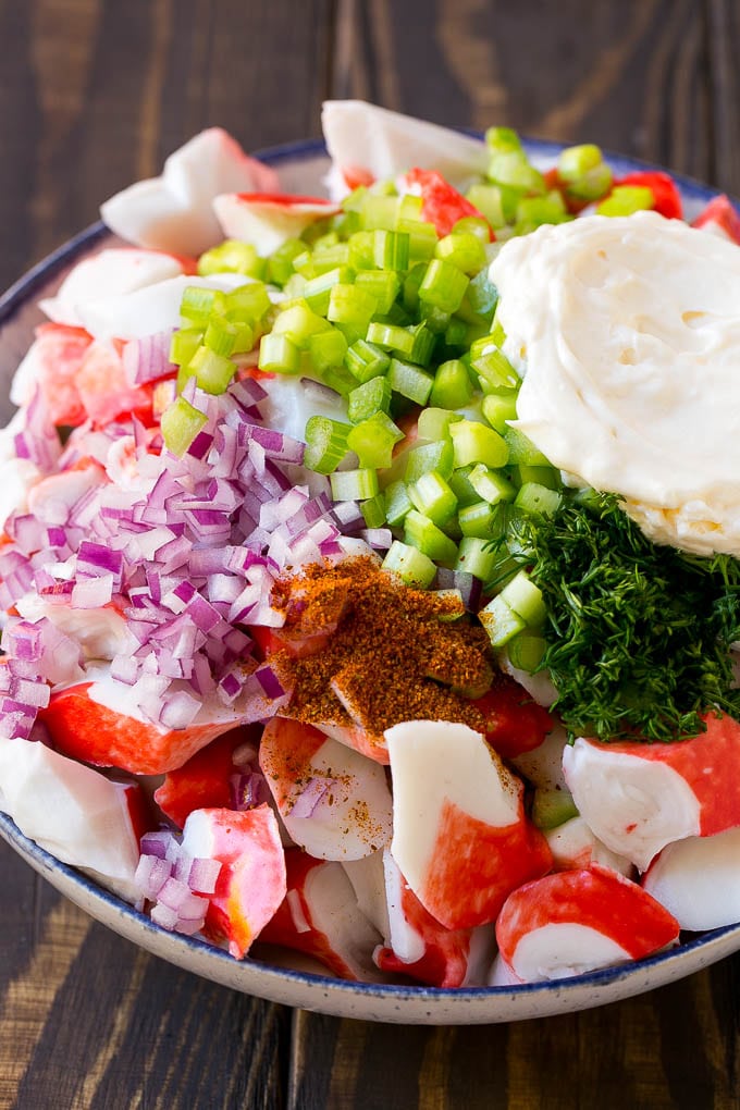 Crab Salad Recipe | Seafood Salad | Deli Salad #crab #salad #seafood #lowcarb #keto #lunch #dinner #fuyos Imitation crab, seasoning, dill, celery and mayonnaise in a bowl.