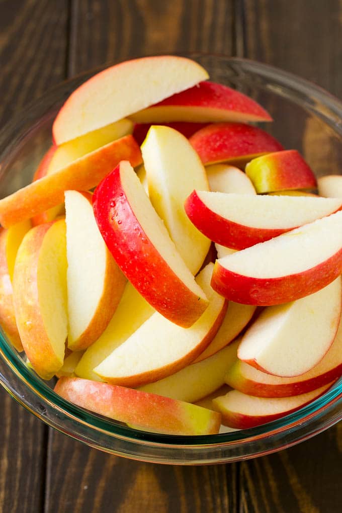 Fried Apples Recipe | Sauteed Apples | Cinnamon Sugar Apples #apples #cinnamon #sugar #sidedish #dessert #fuyos #fall Sliced apples in a mixing bowl.