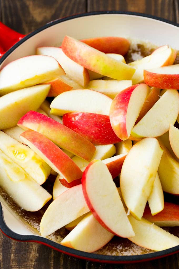Fried Apples Recipe | Sauteed Apples | Cinnamon Sugar Apples #apples #cinnamon #sugar #sidedish #dessert #fuyos #fall Sliced apples in a pan with butter, sugar and cinnamon.