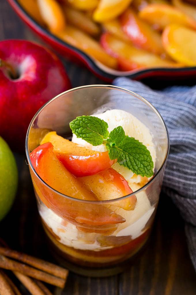 Fried Apples Recipe | Sauteed Apples | Cinnamon Sugar Apples #apples #cinnamon #sugar #sidedish #dessert #fuyos #fall A cup of fried apples served with vanilla ice cream and garnished with fresh mint.