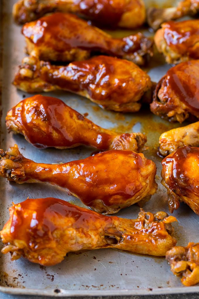 Slow Cooker Chicken Drumsticks Recipe | Crock Pot Chicken Drumsticks | BBQ Chicken Drumsticks #chicken #drumsticks #slowcooker #crockpot #bbq #dinner #fuyos Slow cooker chicken drumsticks on a sheet pan, ready for the broiler.