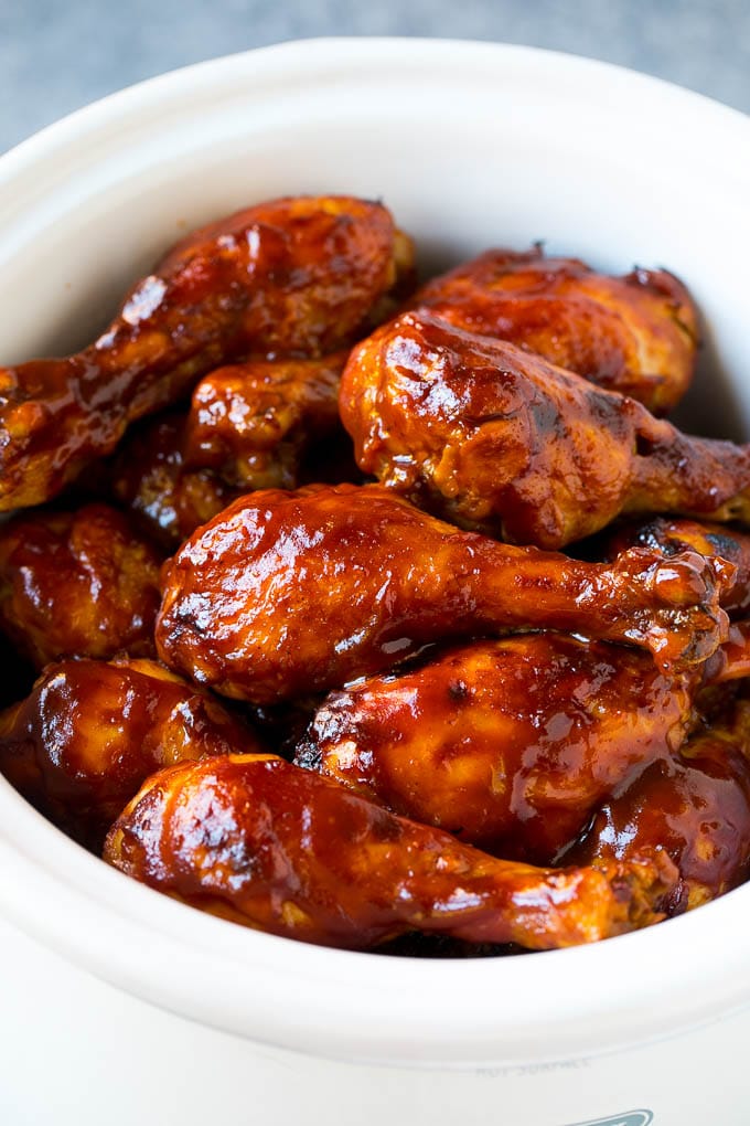 Slow Cooker Chicken Drumsticks Recipe | Crock Pot Chicken Drumsticks | BBQ Chicken Drumsticks #chicken #drumsticks #slowcooker #crockpot #bbq #dinner #fuyos Slow cooker chicken drumsticks coated in BBQ sauce inside a crock pot.