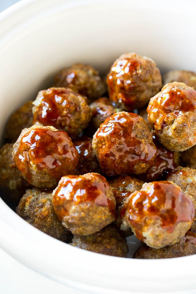 Sweet and Sour Meatballs Recipe | Slow Cooker Meatballs | Crockpot Meatballs | Cocktail Meatballs #meatballs #beef #slowcooker #crockpot #dinner #appetizer #fuyos Meatballs in a slow cooker coated in sweet and sour sauce.