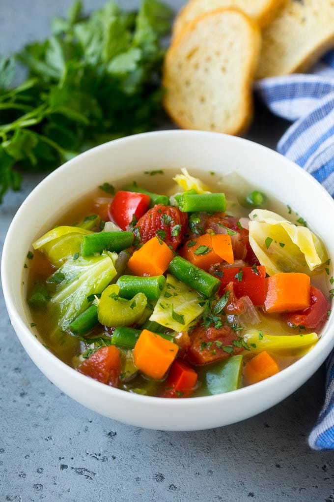 Cabbage Soup Recipe | Vegetable Soup | Veggie Soup | Healthy Soup #soup #healthy #cleaneating #cabbage #vegetables #veggies #dinner #fuyos A bowl of cabbage soup with carrots, celery and tomatoes in broth.