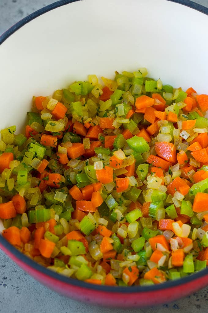 Carrots, onion and celery in a pot.