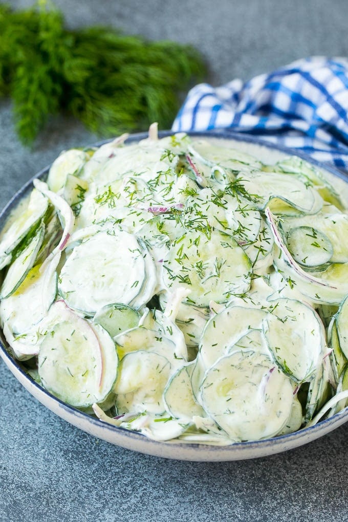 Creamy Cucumber Salad Recipe | German Cucumber Salad | Cucumber Salad #cucumber #salad #dinner #lunch #fuyos #cucumbersalad A serving bowl of creamy cucumber salad topped with fresh dill.