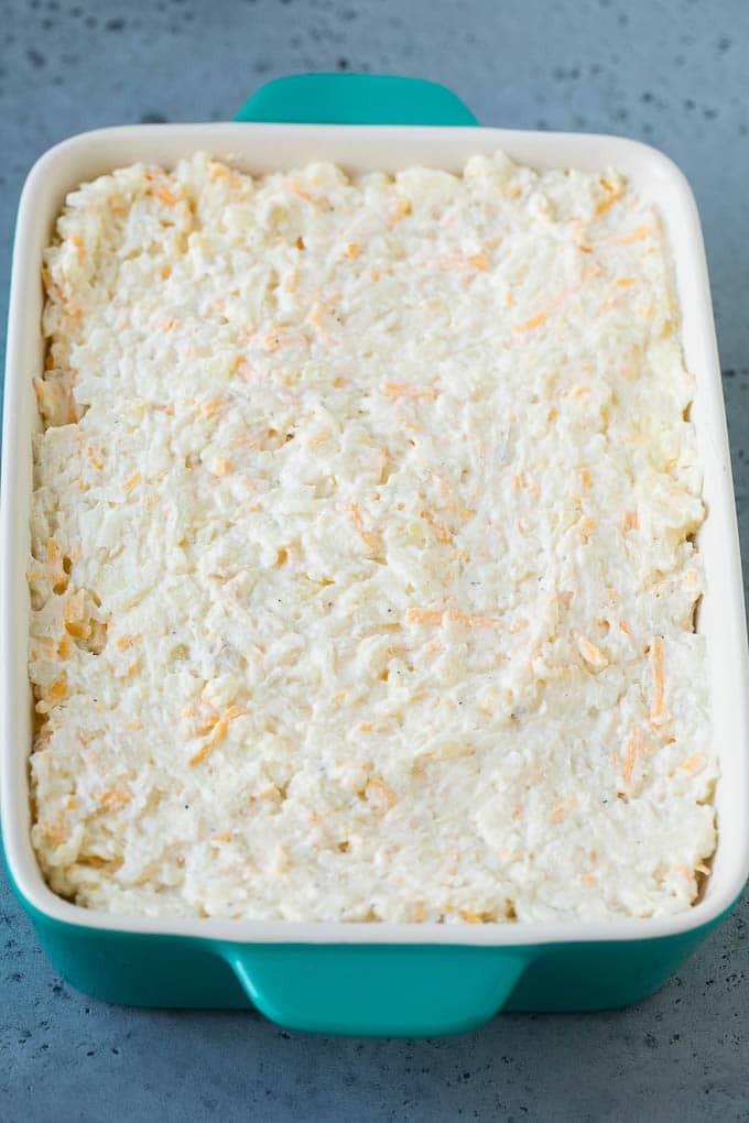 Hash Brown Casserole | Potato Casserole | Hash Brown Side Dish #potatoes #cheese #casserole #sidedish #fuyos A mixture of hash browns, sour cream, cheese and seasonings in a casserole dish.