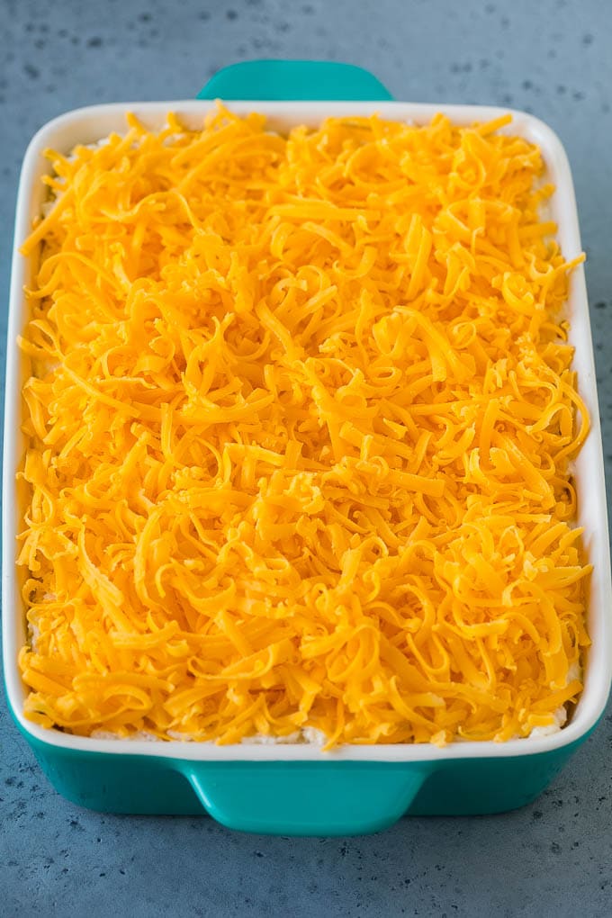 Hash Brown Casserole | Potato Casserole | Hash Brown Side Dish #potatoes #cheese #casserole #sidedish #fuyos A shredded potato dish covered with shredded cheddar cheese!