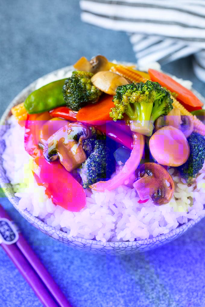 Vegetable Stir Fry Recipe | Veggie Stir Fry | Broccoli Stir Fry #vegetarian #vegetables #broccoli #dinner #fuyos Vegetable stir fry served over rice in a bowl.