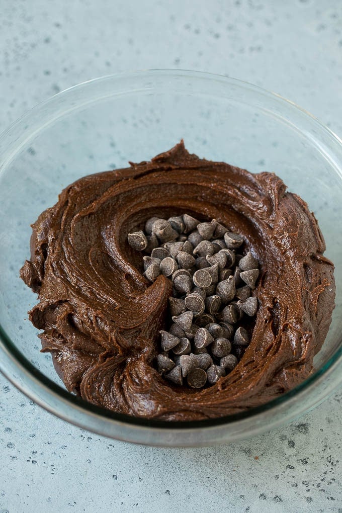 Cheesecake Brownies Recipe | Cream Cheese Brownies | Homemade Brownies #brownies #cheesecake #chocolate #dessert #fuyos Brownie batter and chocolate chips in a mixing bowl.