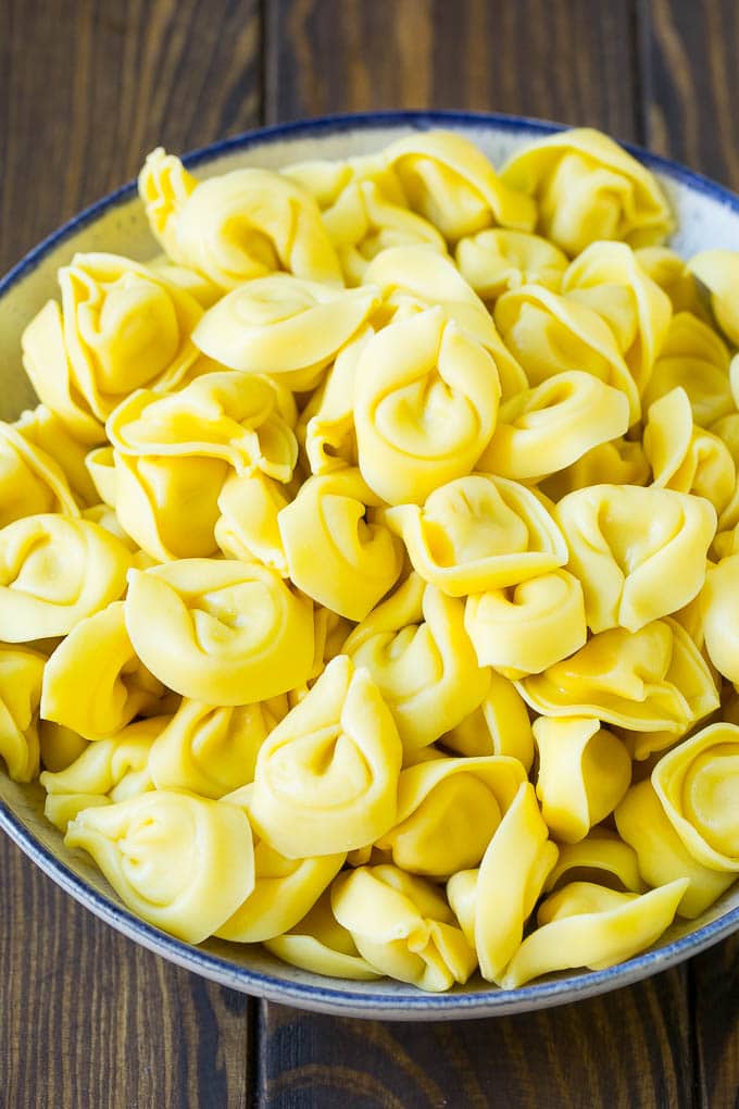 Greek Tortellini Salad Recipe | Pasta Salad | Tortellini Salad | Greek Salad #greek #tortellini #pasta #salad #cucumbers #olives #dinner #fuyos A bowl of cooked cheese tortellini.