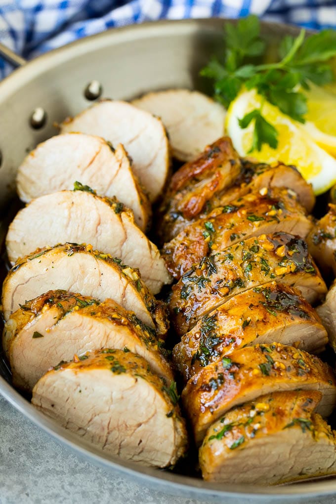 Marinated Pork Tenderloin Recipe | Pork Tenderloin Marinade | Pork Marinade #pork #porktenderloin #marinade #dinner #grilling #fuyos Pork tenderloin marinade with sliced cooked pork in a skillet.