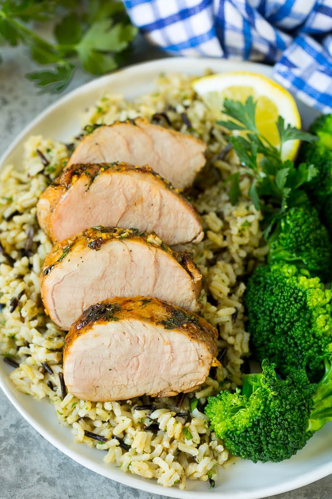 Marinated Pork Tenderloin Recipe | Pork Tenderloin Marinade | Pork Marinade #pork #porktenderloin #marinade #dinner #grilling #fuyos Pork tenderloin marinade over sliced pork, served with rice and broccoli.