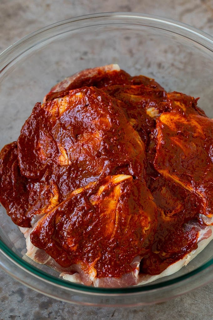 Tacos al Pastor Recipe | Pork Tacos | Mexican Tacos #tacos #pork #pineapple #grilling #tacotuesday #dinner #fuyos Sliced pork shoulder coated in a chile based marinade.