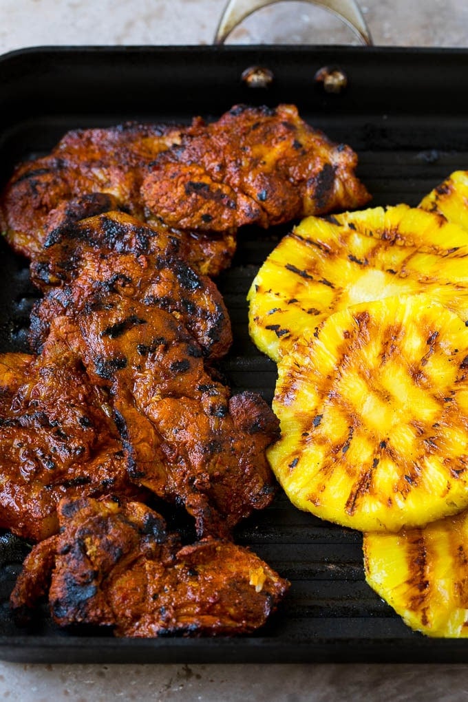 Tacos al Pastor Recipe | Pork Tacos | Mexican Tacos #tacos #pork #pineapple #grilling #tacotuesday #dinner #fuyos Grilled pork and pineapple on a pan.