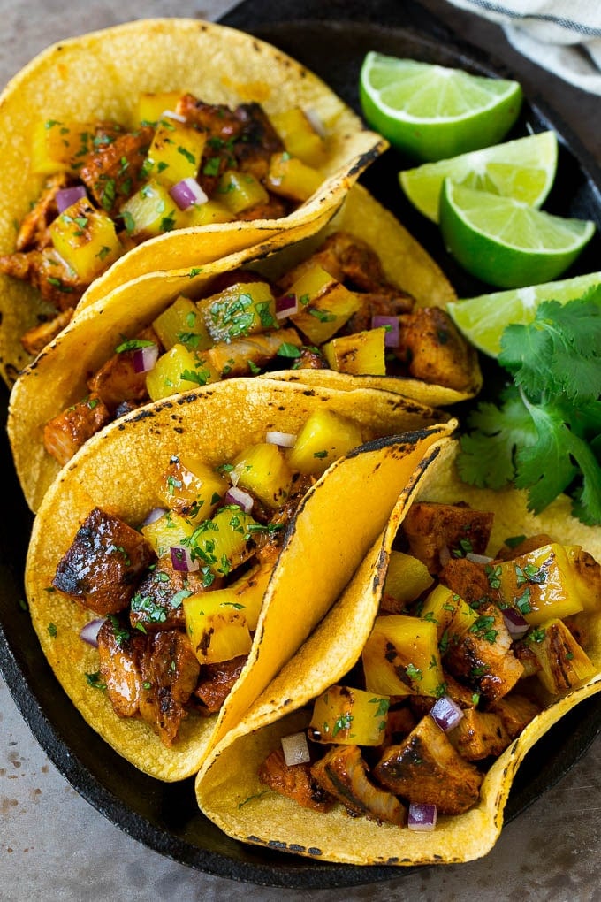 Tacos al Pastor Recipe | Pork Tacos | Mexican Tacos #tacos #pork #pineapple #grilling #tacotuesday #dinner #fuyos Tacos al pastor filled with marinated pork and pineapple.