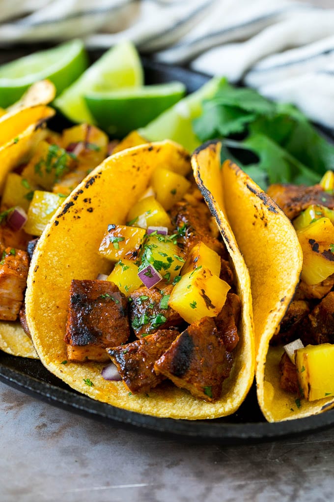 Tacos al Pastor Recipe | Pork Tacos | Mexican Tacos #tacos #pork #pineapple #grilling #tacotuesday #dinner #fuyos Tacos al pastor stuffed with grilled pork, pineapple, red onion and cilantro.