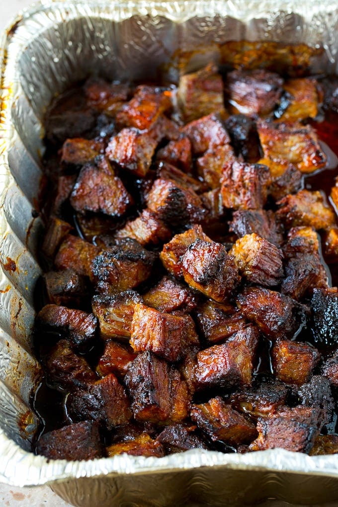 Burnt ends in a foil pan.
