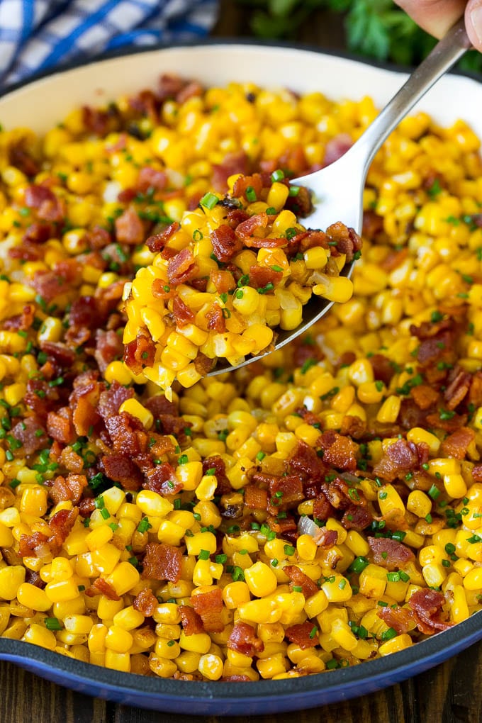 Bacon Fried Corn Recipe | Sauteed Corn | Corn Side Dish #corn #bacon #sidedish #glutenfree #dinner #fuyos A spoonful of fried corn made with bacon and onions.