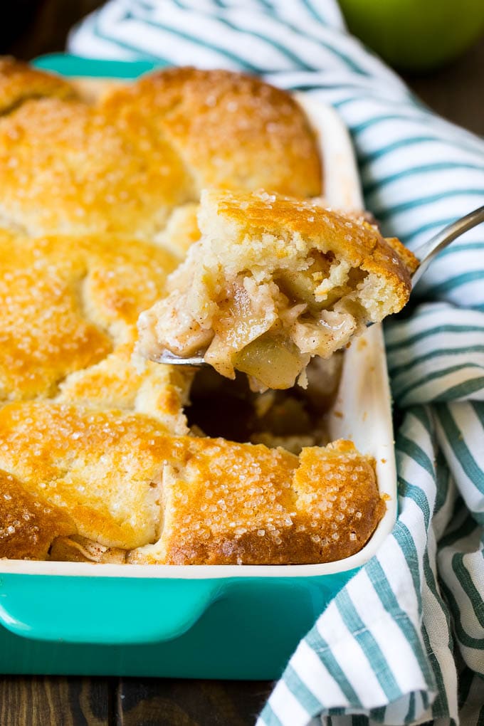 Apple Cobbler Recipe | Apple Dessert #apples #cobbler #dessert #baking #fall #fuyos A spoonful of apple cobbler in the serving dish.