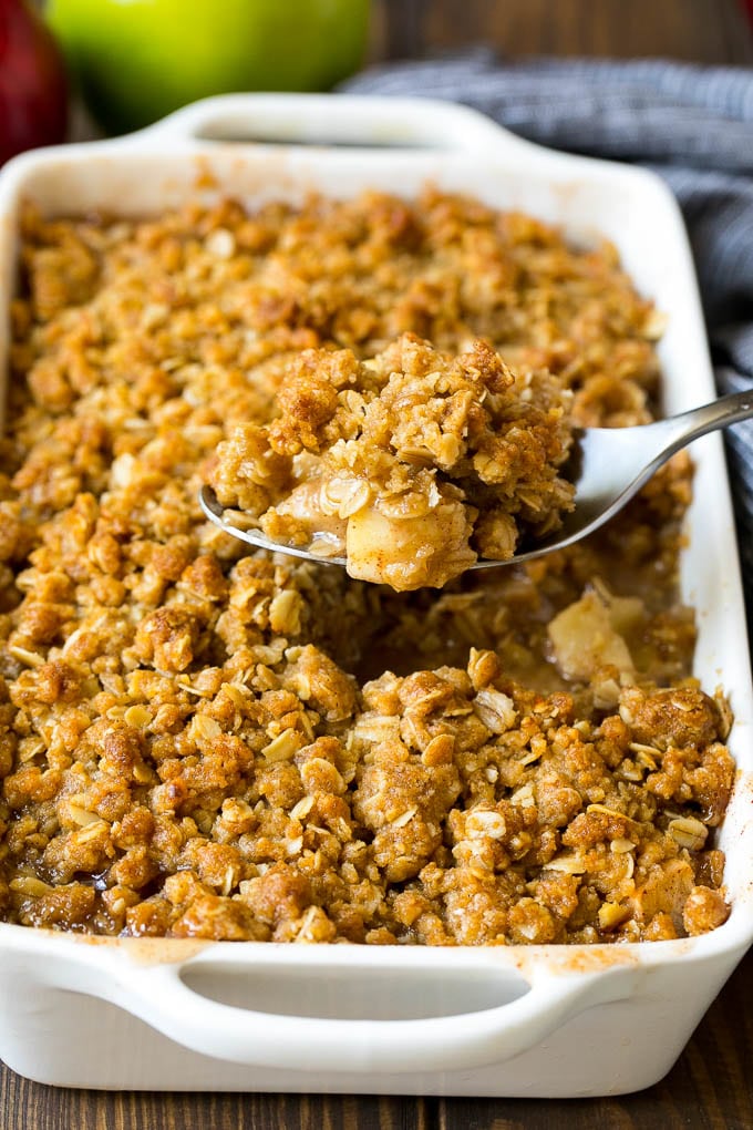 Apple Crisp Recipe | Apple Dessert #apples #dessert #baking #fall #fuyos A spoon serving up a portion of apple crisp.