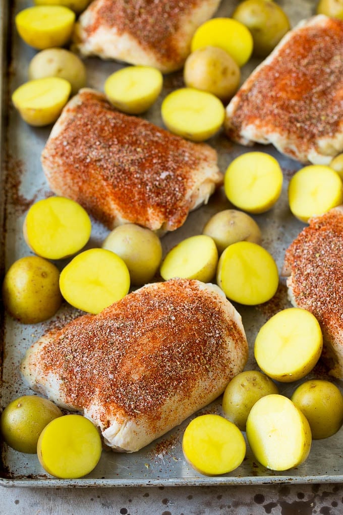 Spanish Chicken Recipe | Sheet Pan Meal | Chicken and Potatoes #spanishfood #chicken #sausage #potatoes #dinner #fuyos Thighs coated in spices with small Yukon golds.