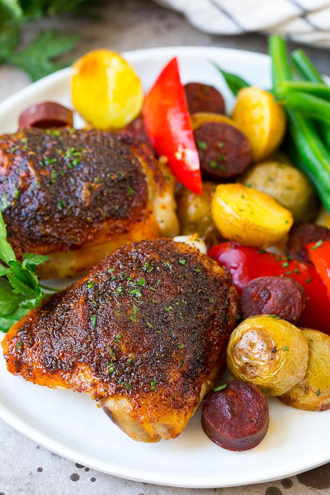 Spanish Chicken Recipe | Sheet Pan Meal | Chicken and Potatoes #spanishfood #chicken #sausage #potatoes #dinner #fuyos A plate of Spanish chicken with potatoes, sausage and vegetables.