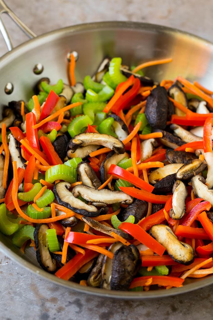 Stir Fry Noodles Recipe | Noodle Stir Fry #chicken #noodles #stirfry #mushrooms #dinner #fuyos Mushrooms, bell pepper, celery and carrot in a pan.
