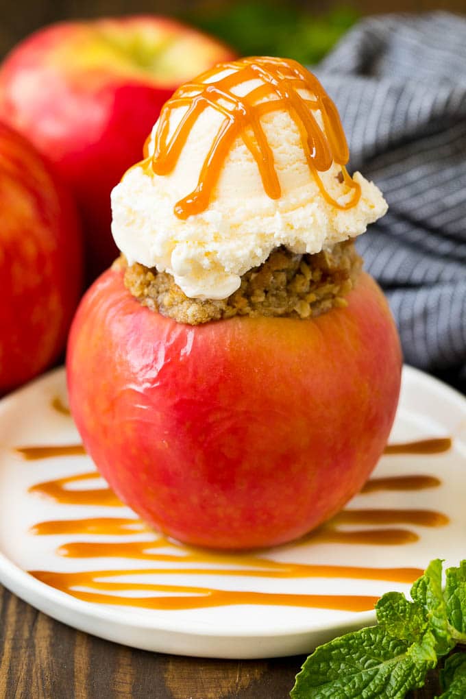 Baked Apples | Stuffed Apples #apples #fall #dessert #sweettooth #fuyos A baked apple topped with vanilla ice cream and caramel sauce.
