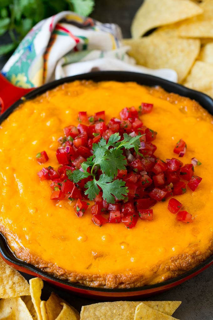 Bean Dip Recipe | Mexican Dip #dip #appetizer #mexicanfood #beans #cheese #fuyos Cheesy Mexican bean dip topped with melted cheese and pico de gallo.